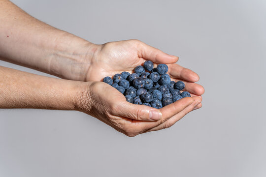 hands with ecological sloes on a sloes background.
