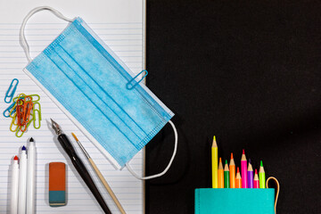 Back to school in 2020. Staying safe with a face mask  as an additional accessory for school