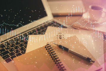 Double exposure of financial chart drawing and desktop with coffee and items on table background. Concept of forex market trading