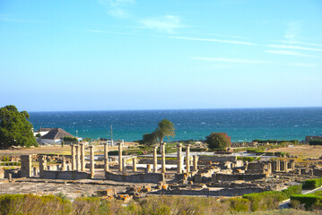 Scenic landscape with ruins of Baelo Claudia is an ancient Roman town on the coast of Spain, Roman city forum, Bolonia, Andalusia, Spain.