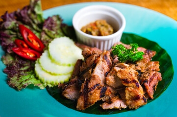 vietnamese style sliced grilled pork with cucumber and red chili