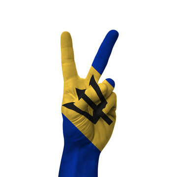 Hand making victory sign, barbados painted with flag as symbol of victory, win, success - isolated on white background