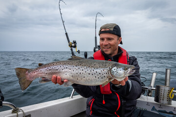 Angler with huge lake trout - 370653981