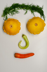 Smiling face of fresh vegetables isolated on a white background.