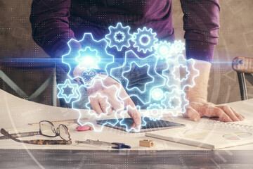 Double exposure of man's hands holding and using a phone and international business theme drawing.