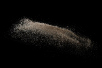 Gold sand explosion isolated on black background. 