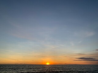 Landscape view of vibrant sunset over calm seascape