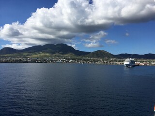Landscape view of coastline city on tropical mountain island 