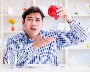Man running out of money in restaurant and using savings from pi