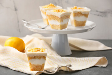 Delicious cupcakes in jars on table