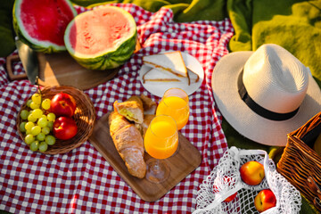 Fototapeta na wymiar Tasty food and drink for romantic picnic in park