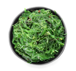 Bowl with tasty seaweed salad on white background
