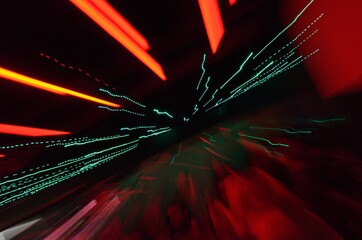 Long exposure photo of color LED and Neon lights with camera motion and dark background