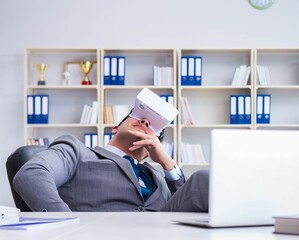 Businessman with virtual reality glasses in modern technology co