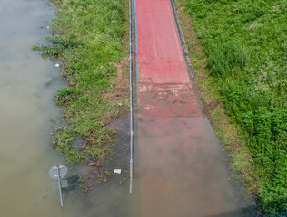 Bicycle riding path submerged under water