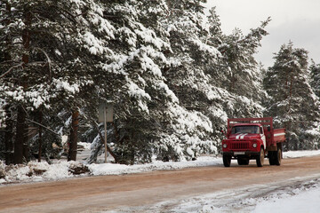 Old soviet fire truck in winter forest