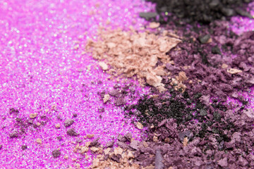 Fototapeta premium Black,Purple and Nude eyeshadow on a Glittery background