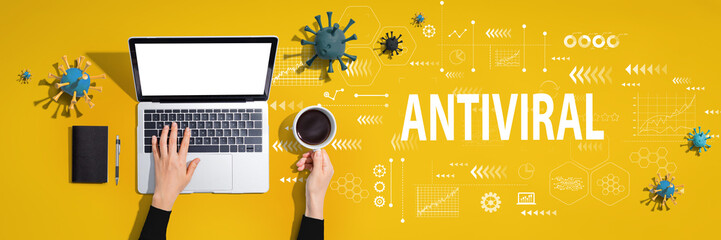 Fototapeta na wymiar Antiviral Coronavirus theme with person using a laptop computer