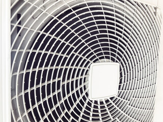 Compressor of air conditioner, the behinde of white machine that similar to the fan blades. There is a white sieve covered