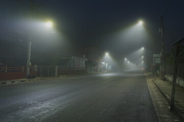 Light and fog in the morning, dangerous lonely road