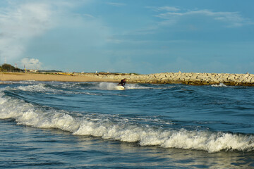 
A man riding a water scooter Summer vacation in the tropical sea The hobby of a young man riding the sea Water sport scooter activities