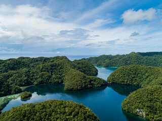 Aerial shot of tropical rock islands in calm tranquil secluded bay in Palau Micronesia