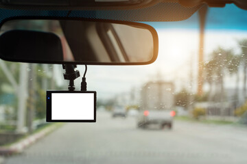 Close up car on highway at sunset, with video recorder next to a rear view mirror,video recorder...