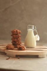 chocolate cookies with white milk on the table.
