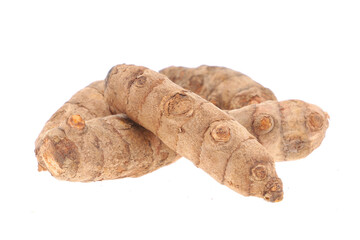 Turmeric powder and turmeric isolated on white background.