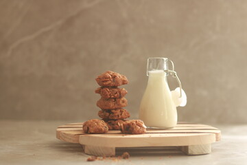 chocolate cookies with white milk on the table.