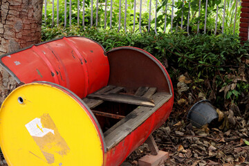 red and yellow watering can