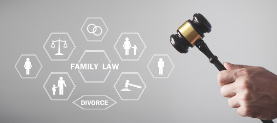 Male hand showing judge gavel. Family Law