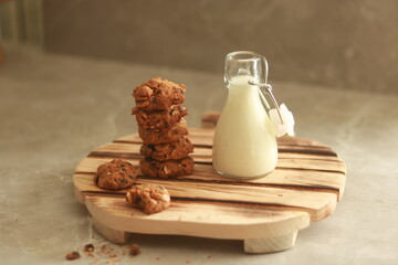 chocolate cookies with white milk on the table.