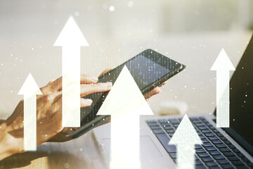 Creative abstract upward arrows sketch and hand working with a digital tablet on background, target...