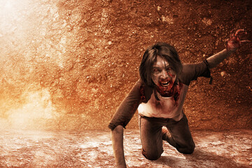 Scary zombie with blood and wound on his body crawling on the floor