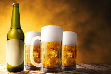 Beer bottle and glass of cold beer on the table