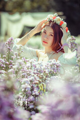 Fototapeta premium Beautyful Asian woman in the flower garden