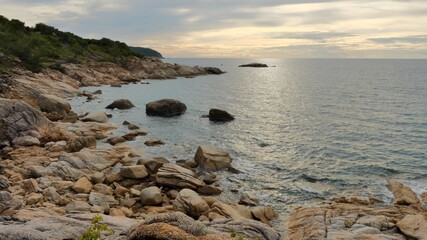 Rocky coastline at koh Phangan island in sunset time, Thailand