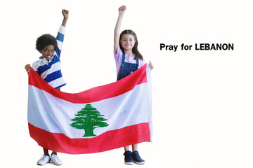 White skinned girl and dark skinned boy holding the flag of Lebanon on white background, Pray for Lebanon, Pray for Beirut, Hand raised up with a clenched fist, with clipping path