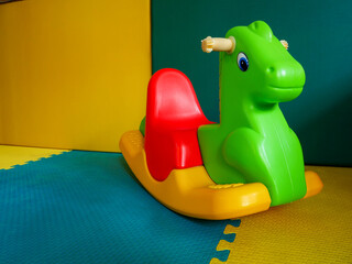 Rocking horse toys kid. children's playground, playroom with plastic colorful educational, preschoolers kindergarten.