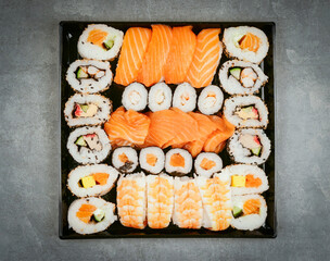 Japanese sushi food. Maki ands rolls with tuna, salmon, shrimp, crab and avocado.  assorted sushi