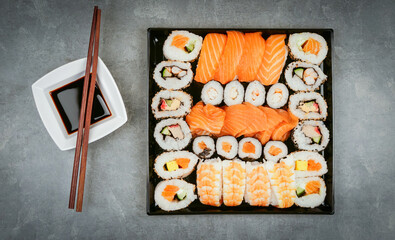 Japanese sushi food. Maki ands rolls with tuna, salmon, shrimp, crab and avocado.  assorted sushi