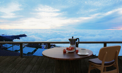 Wooden table and chair set with black coffee with fresh strawberries on the terrace or balcony....