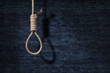suicide concept. noose with shadow on dark wall background - obrazy, fototapety, plakaty