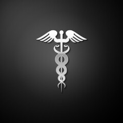 Silver Caduceus medical symbol icon isolated on black background. Medicine and health care concept. Emblem for drugstore or medicine, pharmacy snake. Long shadow style. Vector.