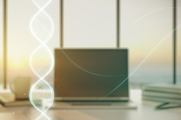 Double exposure of creative DNA hologram on laptop background. Bio Engineering and DNA Research...