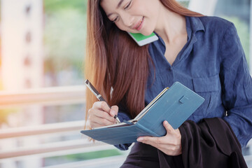 Agenda of planner woman schedule and organize appointment 2020 Calendar Event. Smart Business woman note and schedule to set timetable organize schedule. Woman hands writing on Agenda.Timeline concept