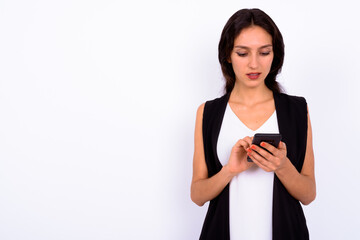 Fototapeta premium Portrait of young beautiful businesswoman using phone