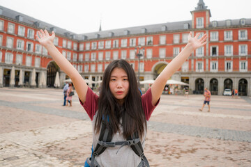 Fototapeta na wymiar young Asian woman visiting Europe in holidays as backpacker tourist - happy and attractive Chinese girl enjoying city tour cheerful in tourism and vacation travel concept