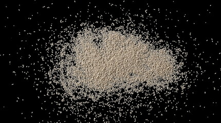 Active dry yeast pile isolated on black background and texture, top view with clipping path